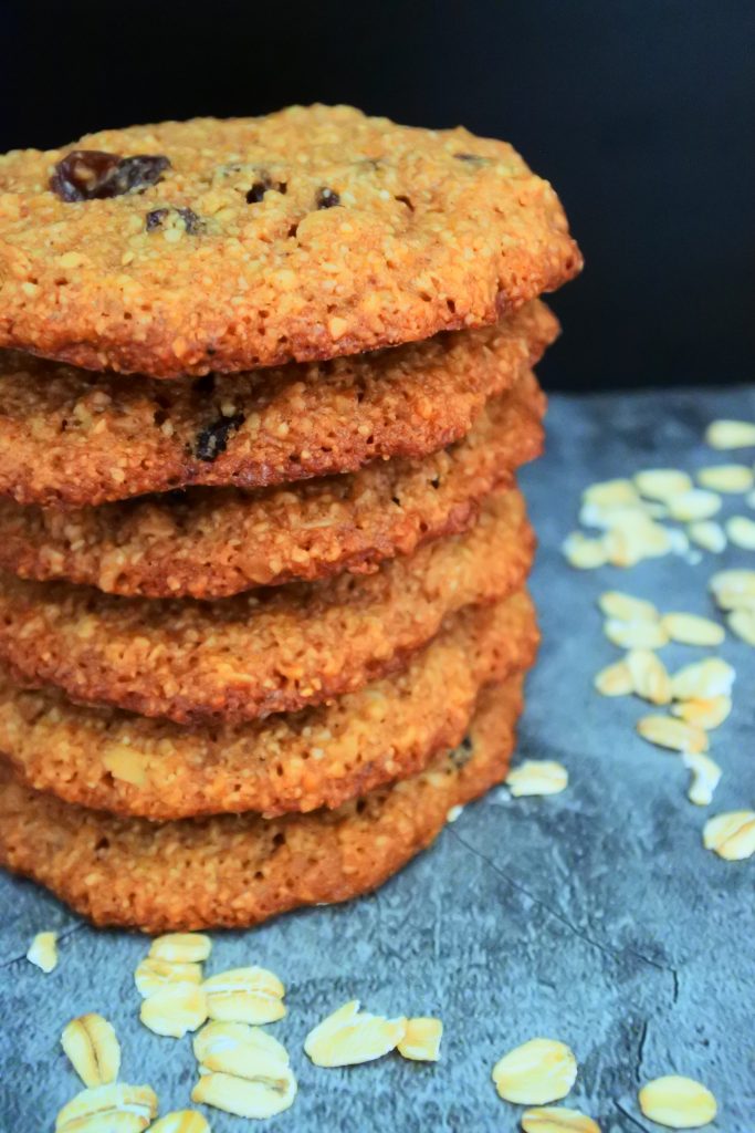 A close up image of a stack of oatmeal raisin cookies