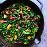 An overhead image of sauteed rainbow chard in a skillet