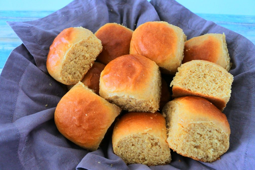 An angled image of a basket of freshly baked dinner rolls