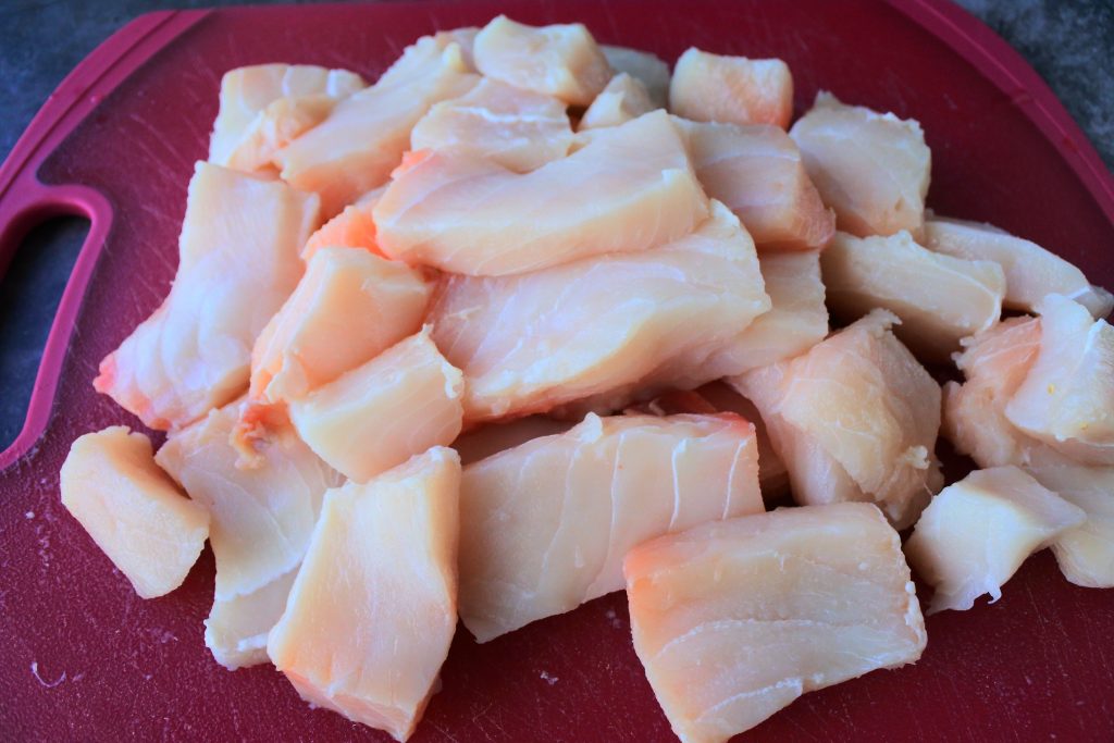 An angled close up image of fillets of shark (fish)