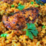 A close up image of a skillet with arroz con pollo