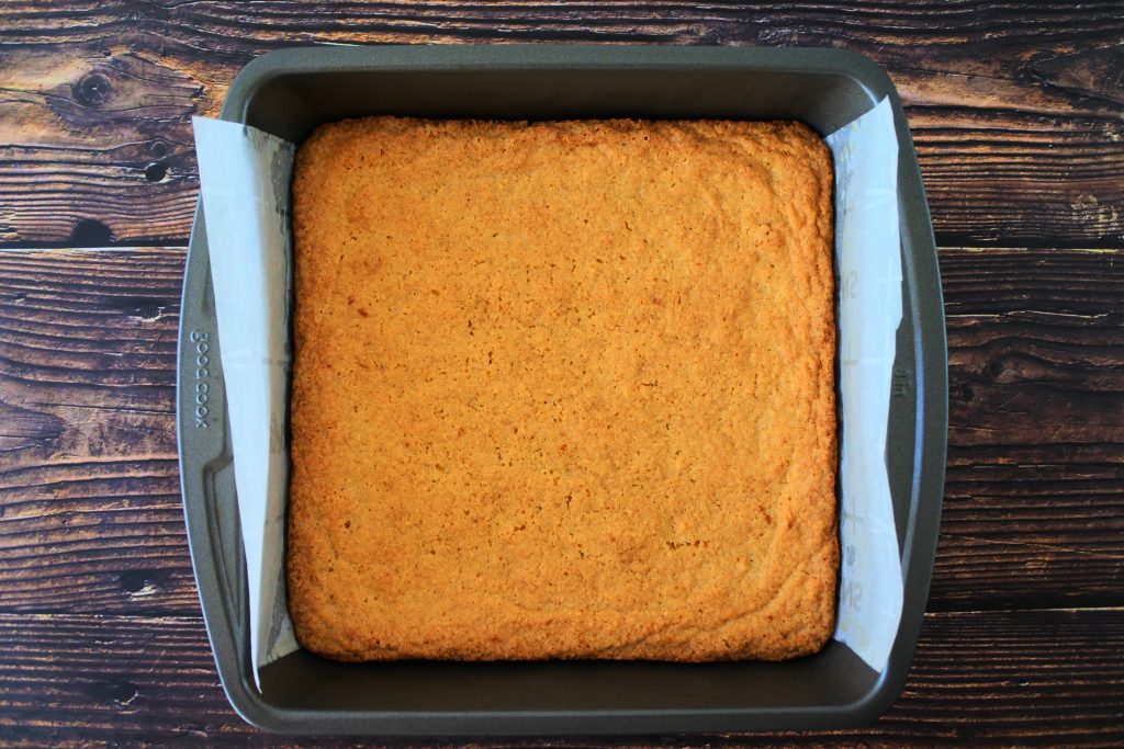 An overhead image of a baked tray of boterkoek