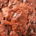 An overhead image of the top of a stack of chewy gluten free brownies.