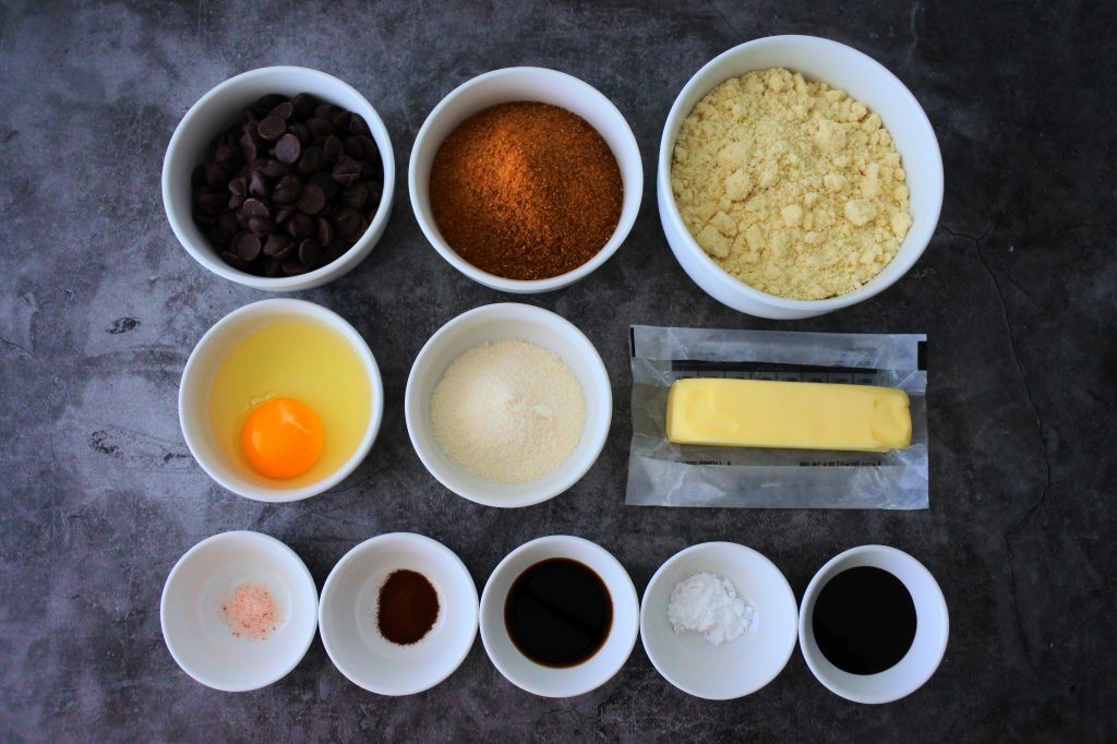 An overhead image of bowls of ingredients for gluten free chocolate chip cookie dough