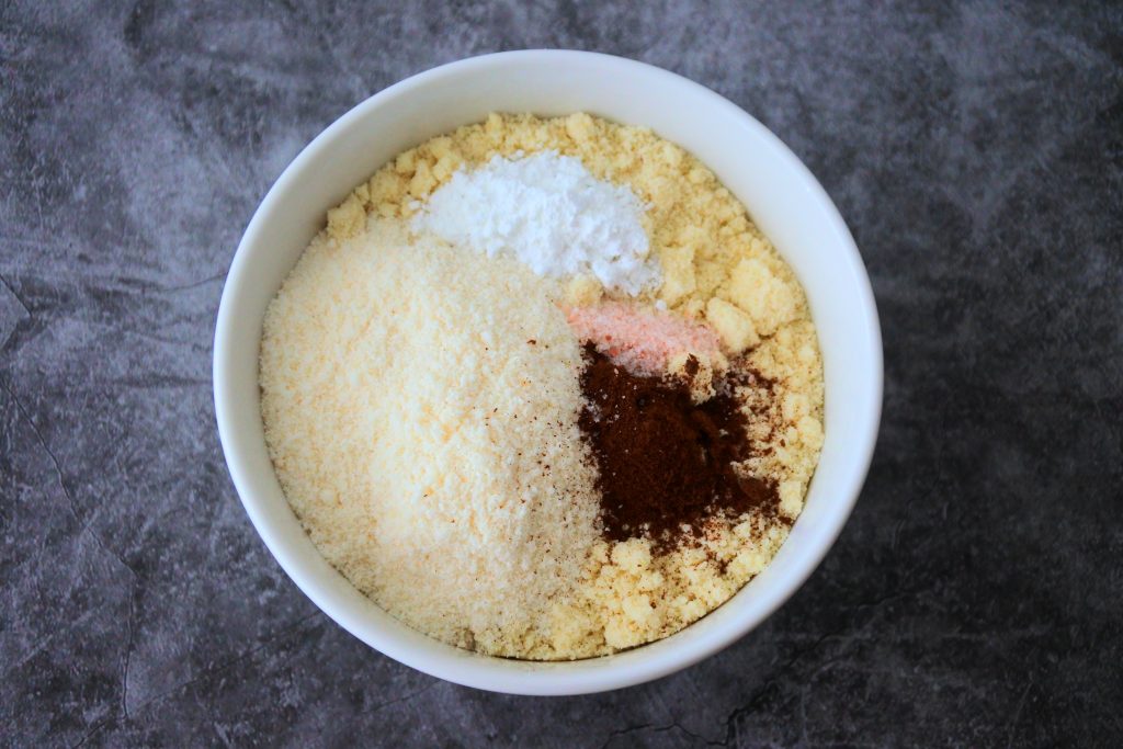 An overhead image of dry ingredients for gluten free cookie dough in a bowl