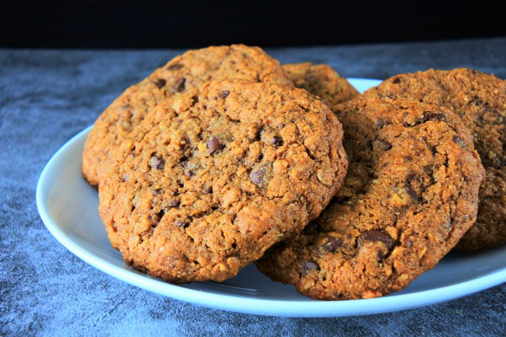 A plate of freshly baked oatmeal chocolate chip cookies