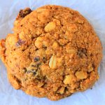 A close up overhead image of an oatmeal raisin cookie