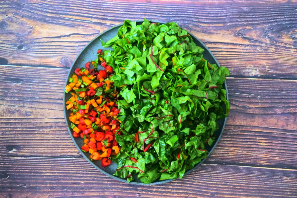 An overhead image of a plate of chopped swiss chard.