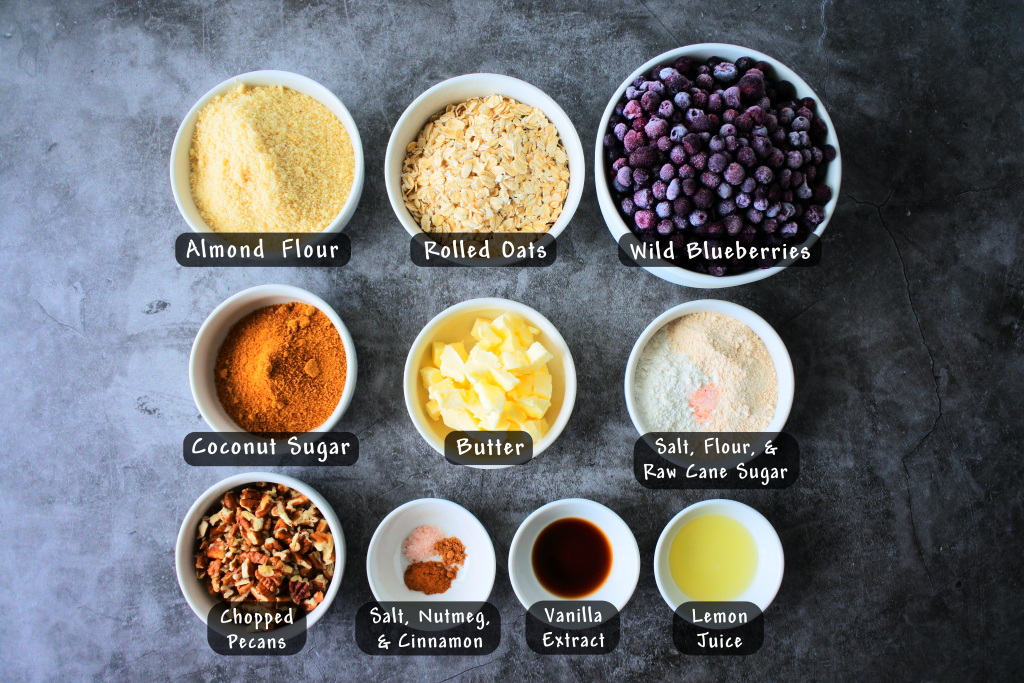 An overhead image of bowls of ingredients needed for a blueberry crisp