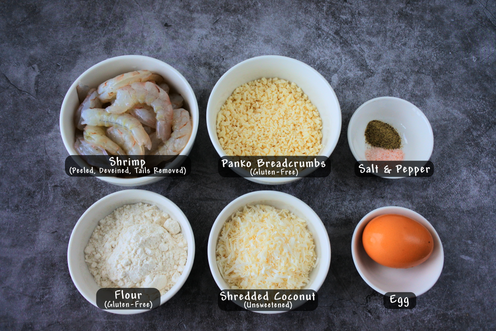 An overhead image of bowls of ingredients for coconut shrimp