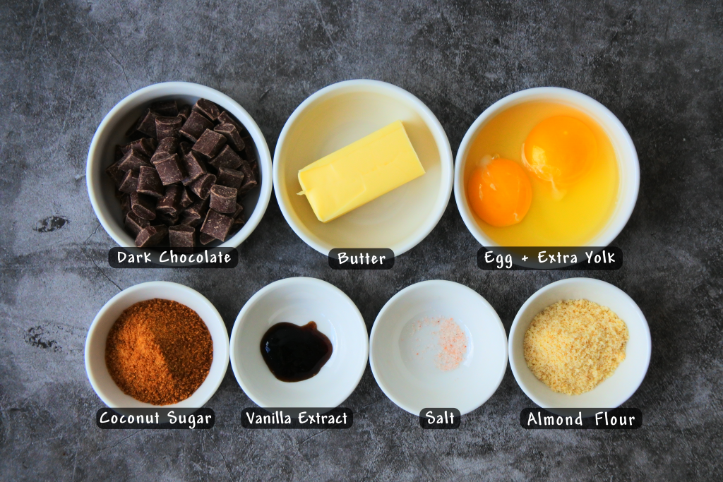 An overhead image of of bowls of ingredients for molten chocolate cake