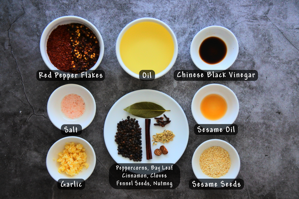 An overhead image of bowls of ingredients for a homemade Chinese hot oil