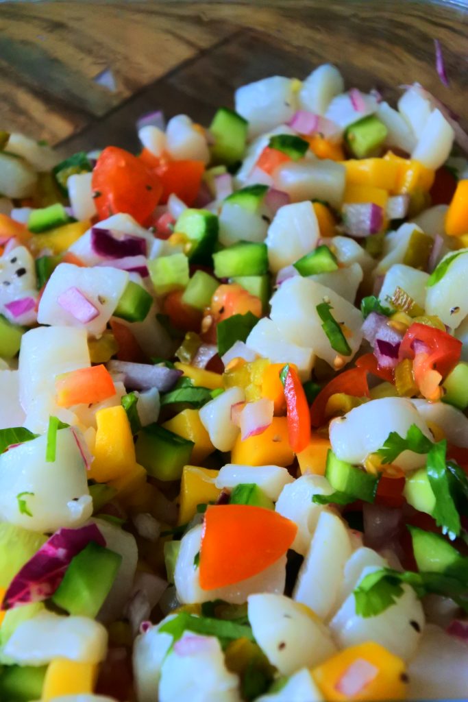 A close up image of freshly made scallop ceviche