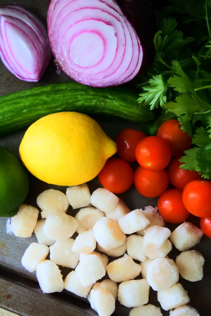 An overhead image of fresh ingredients needed for a fresh scallop ceviche