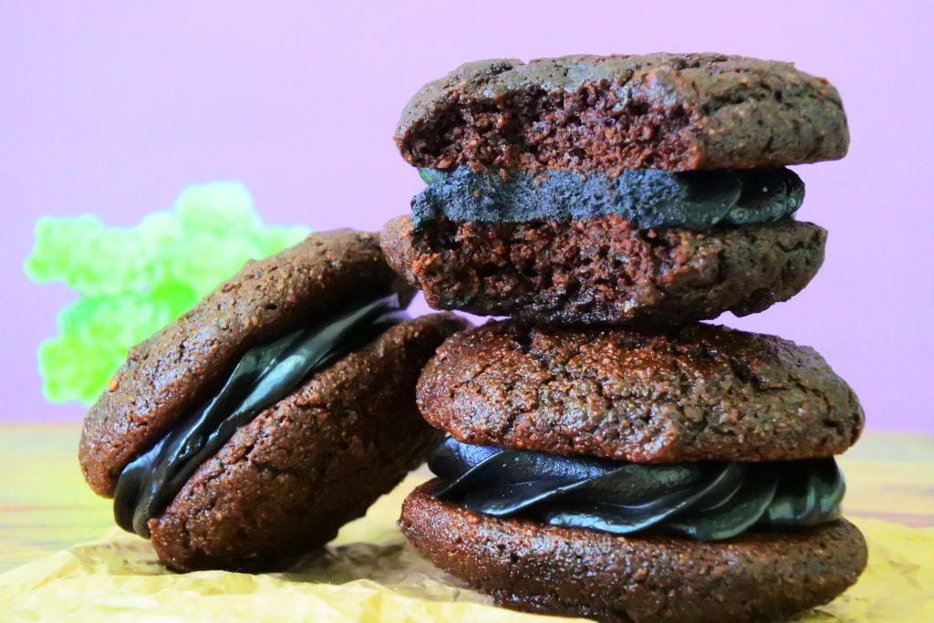 A head on image of chocolate whoopie pies with a black cocoa filling