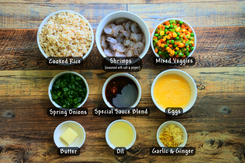 An overhead image showing bowls of ingredients for a quick and easy shrimp fried rice.