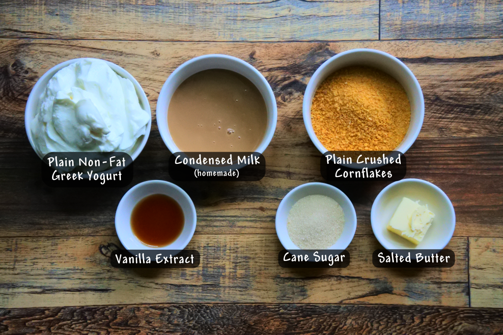 An overhead image showing the ingredients needed for a gluten-free Greek yogurt cheesecake