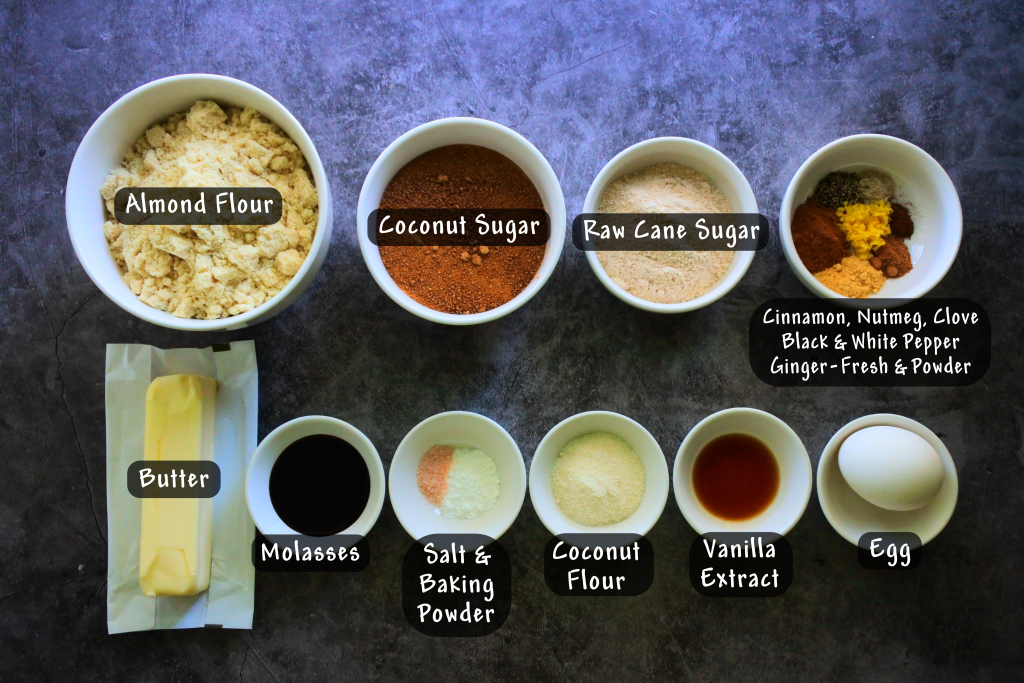 An overhead image of bowls with ingredients needed to make gluten free gingerbread cookies