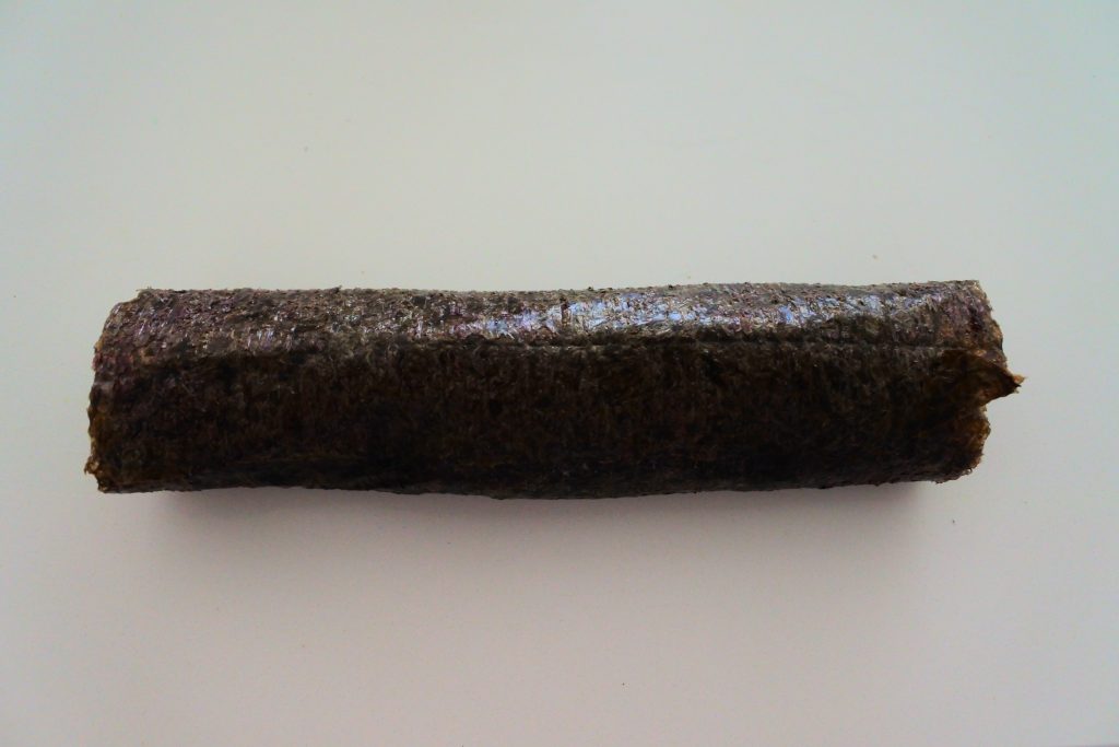 An overhead image of a rolled up sushi roll