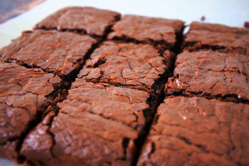 An angled image showing the top of a tray of cut brownies