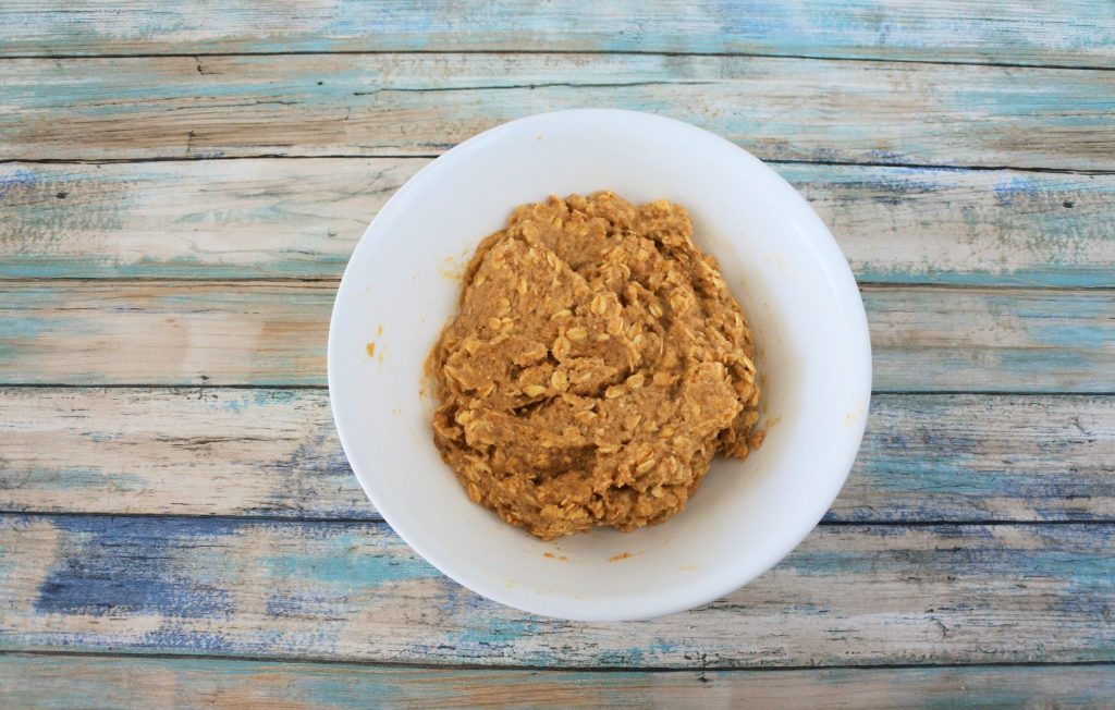 An overhead image of a bowl of banana oatmeal cookie dough