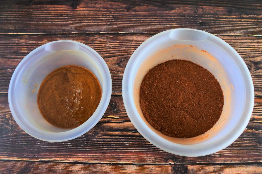 An overhead image of two bowls with wet and dry ingredients for a chocolate cookie dough
