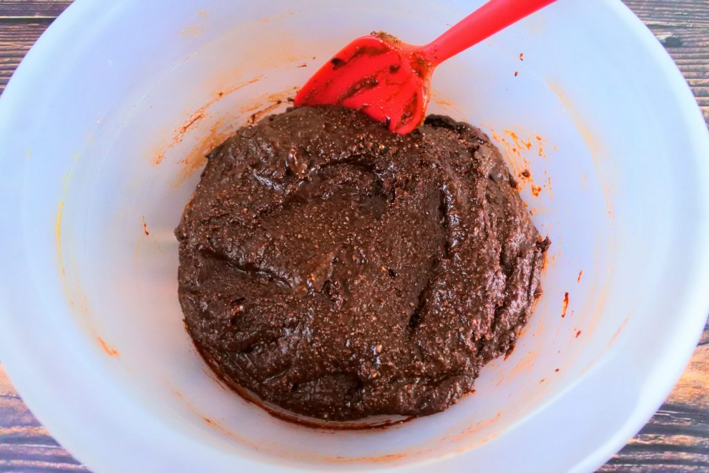 An overhead image of chocolate cookie dough in a bowl