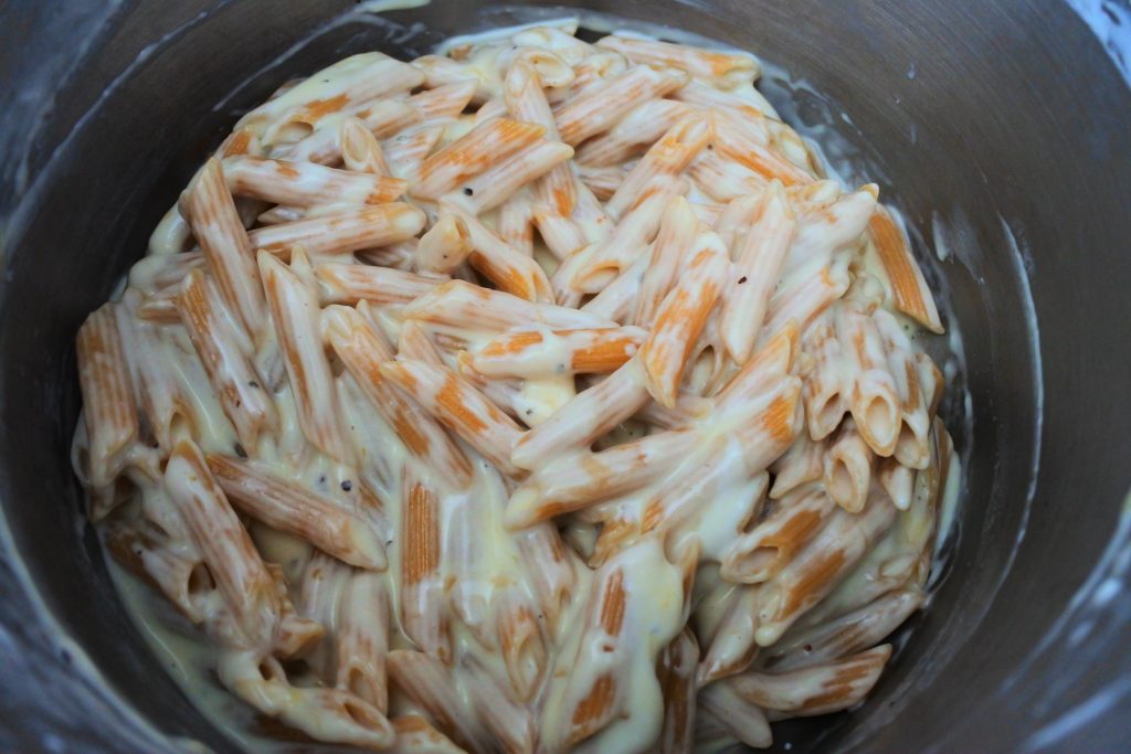 An overhead image of smoked Gouda mac and cheese in a pot