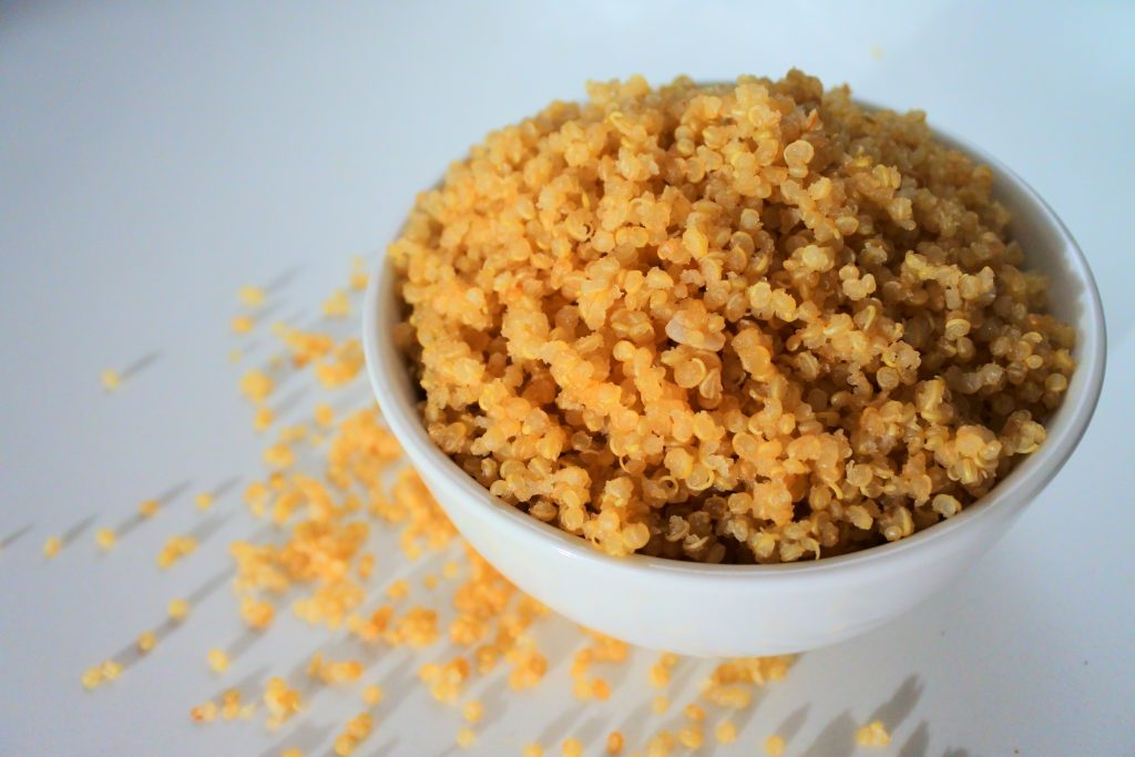A head on image of a bowl of fluffy quinoa