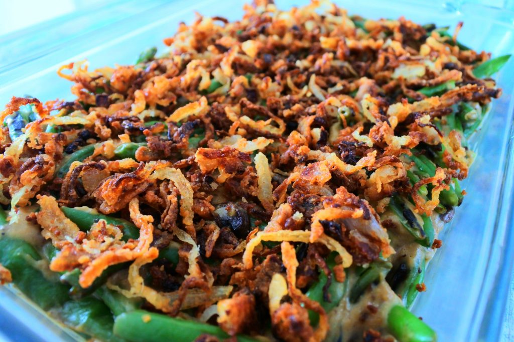 An angled image of crispy onions on a green bean casserole
