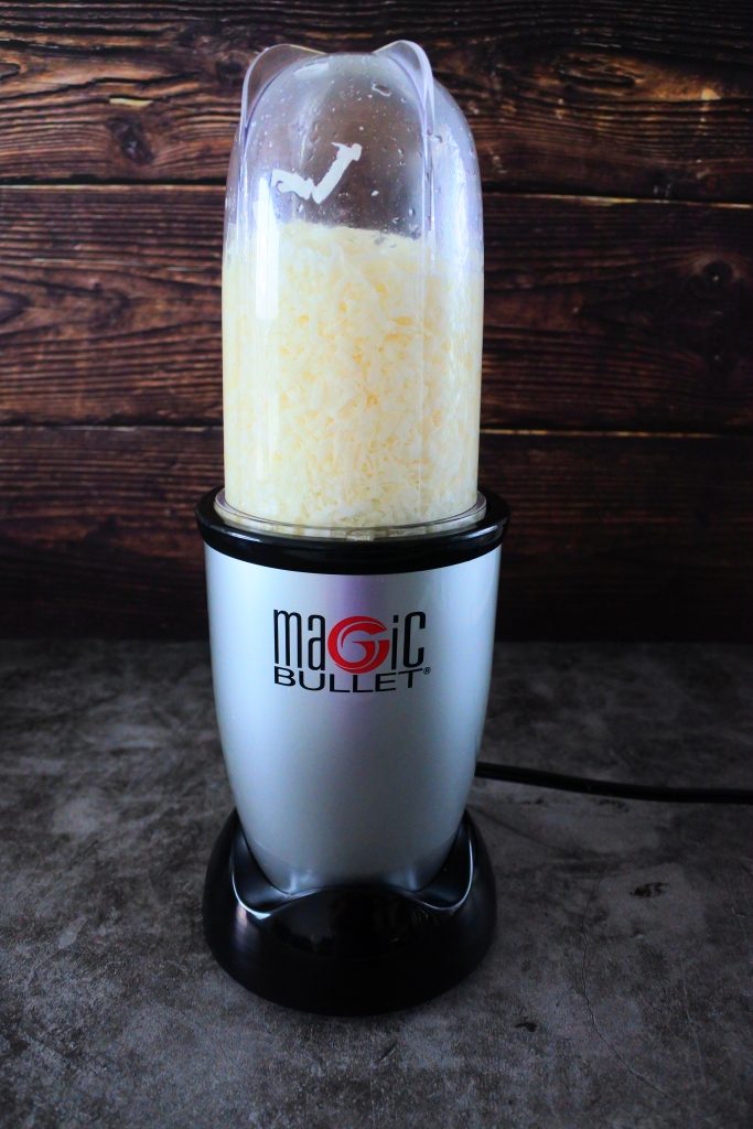 A head on image of coconut being blended in a blender