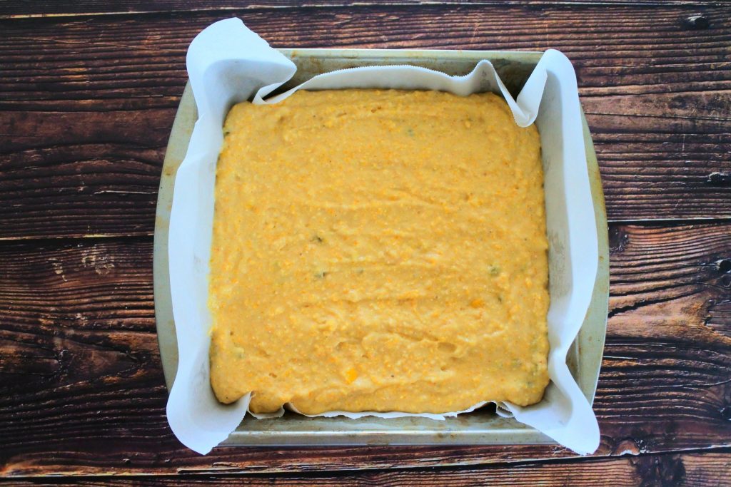 An overhead image of a pan of unbaked jalapeno cornbread batter