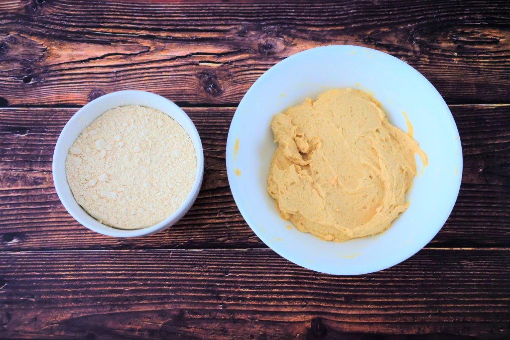 An overhead image of a bowl of dry ingredients and a bowl of creamed butter, sugar and egg.