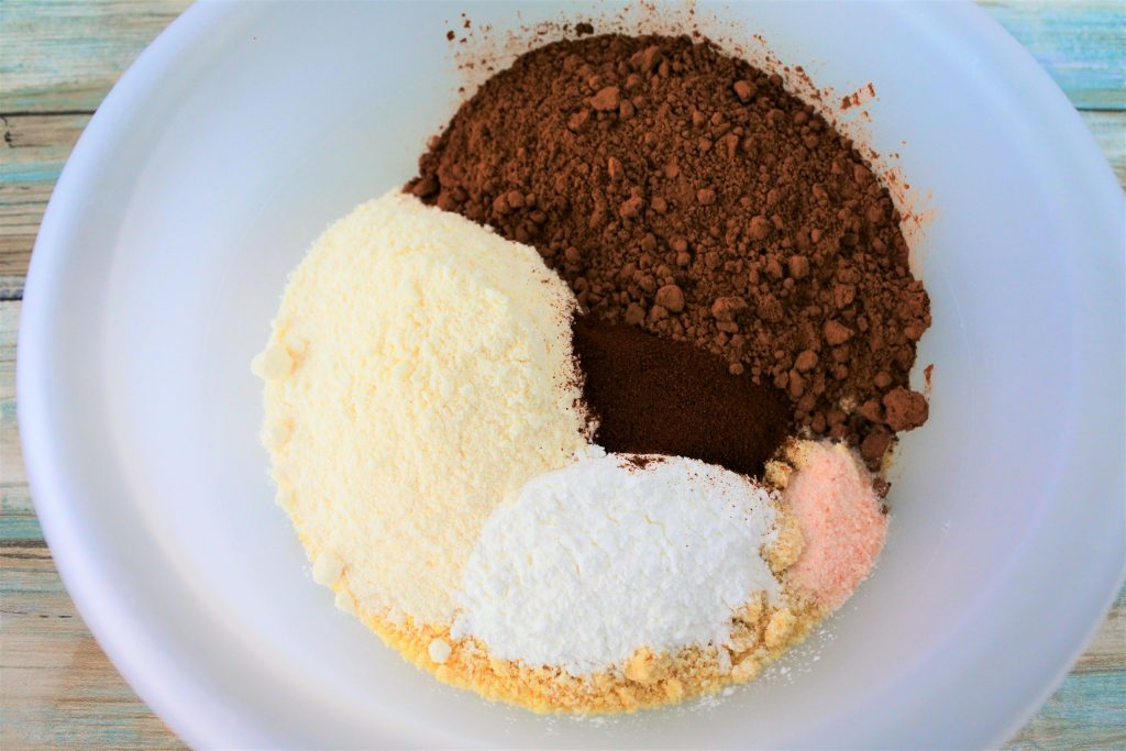 An overhead image of dry ingredients for GF Double Chocolate Muffins in a bowl