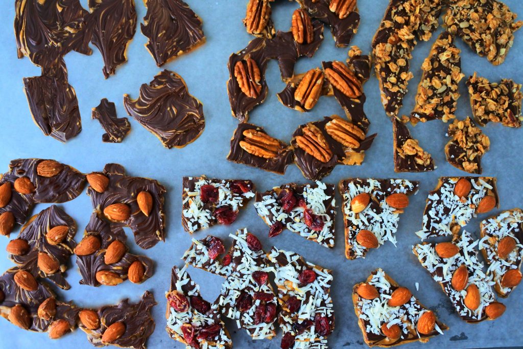 A head on image of pieces of peanut butter bark with various toppings