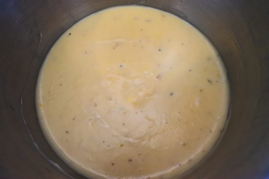An overhead image of a cheesy roux sauce