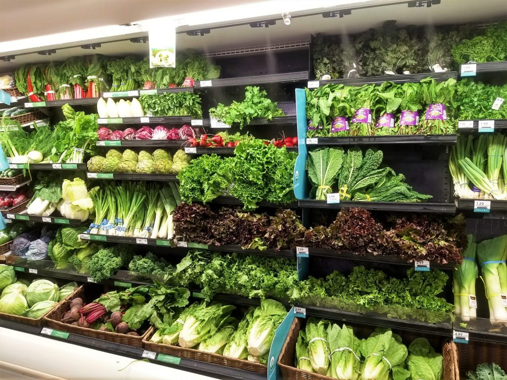 Image of a supermarket's fresh green produce aisle