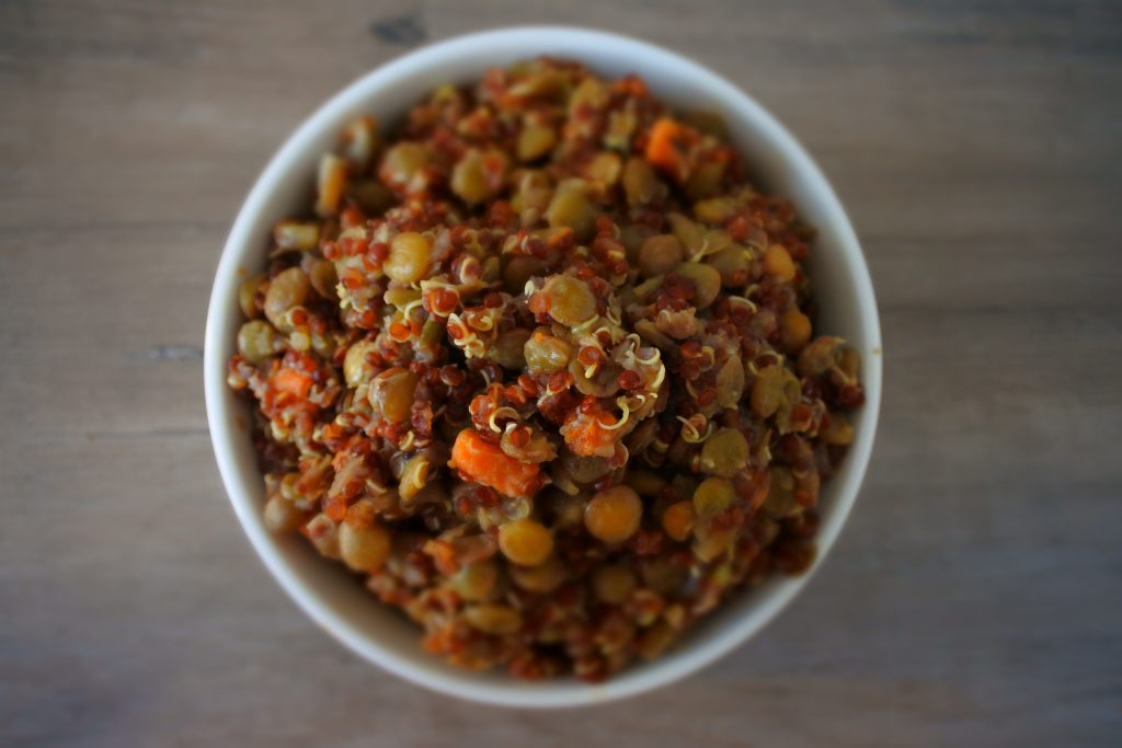 An overhead image of a bowl of quinoa and lentil pilaf