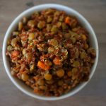 An overhead image of a bowl of quinoa and lentil pilaf