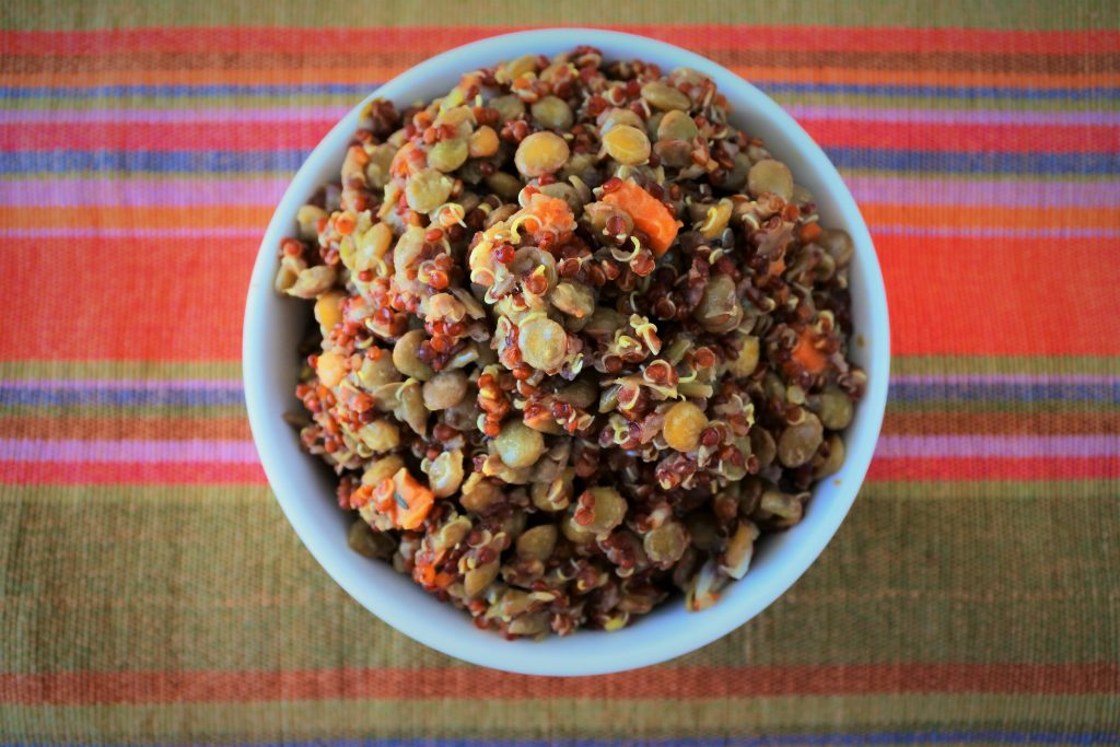 An overhead image of a bowl of quinoa and lentil pilaf