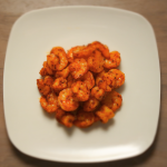 An overhead image of a plate of chipotle fried shrimp