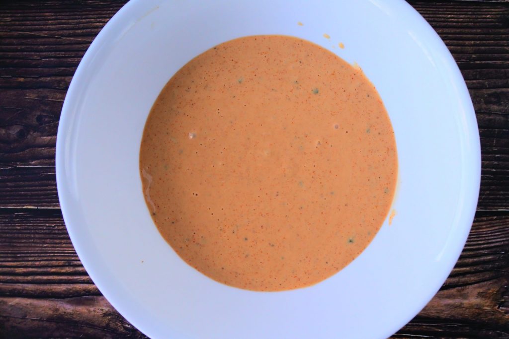 An overhead image of a bowl of homemade thousand island dressing.